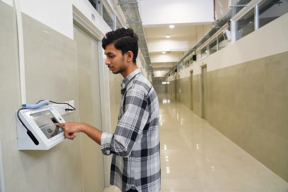Student using biometric entry system