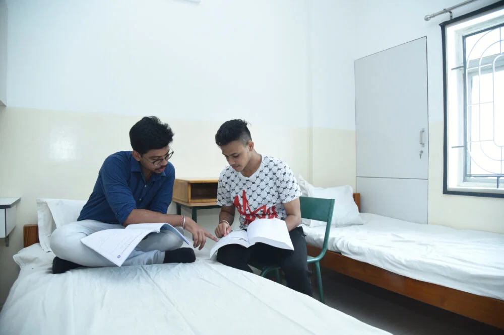 Students studying in a hostel room